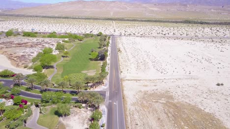 An-aerial-contrast-of-greenery-and-desert-near-Palm-Springs-California