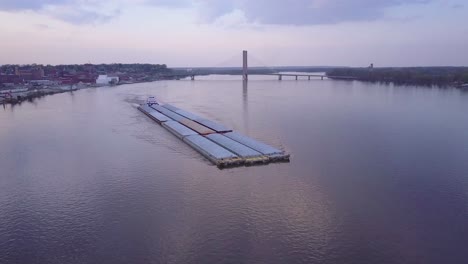 A-beautiful-aerial-of-a-barge-traveling-on-the-Mississippi-River-1
