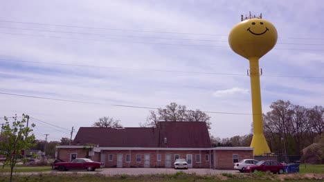 A-smiley-faced-water-tank-towers-above-a-seedy-and-depressing-motel