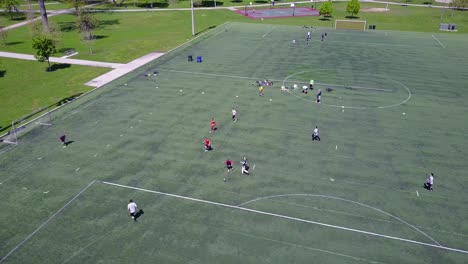 Aerial-shot-over-an-amateur-soccer-match-on-a-soccer-field