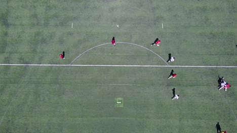 Vista-Aérea-shot-over-an-amateur-soccer-match-on-a-soccer-field-1