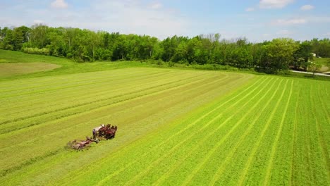 A-beautiful-aerial-of-Amish-farmers-tending-their-fields-with-horse-and-plow-2