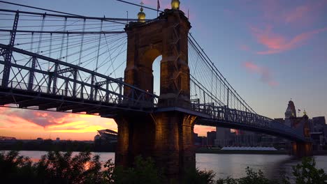 A-beautiful-evening-shot-of-Cincinnati-Ohio-with-bridge-crossing-the-Ohio-River-foreground