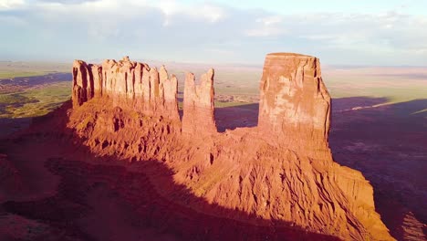 Beautiful-inspiring-aerial-at-sunset-over-rock-formations-in-Monument-Valley-Utah-1