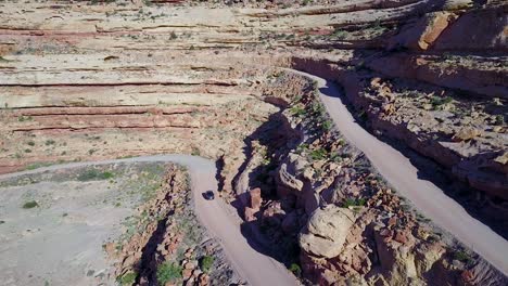 Aerial-as-a-car-travels-on-the-dangerous-mountain-road-of-Moki-Dugway-New-Mexico-desert-Southwest-4