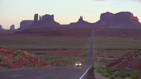 Cars-drive-on-a-highway-near-Monument-Valley-navajo-Tribal-Park-Utah