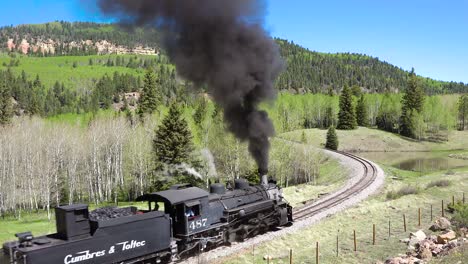 Low-of-the-Cumbres-and-Toltec-steam-train-moving-through-Colorado-mountains-near-Chama-New-Mexico-1