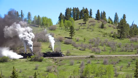 Low-of-the-Cumbres-and-Toltec-steam-train-moving-through-Colorado-mountains-near-Chama-New-Mexico-3