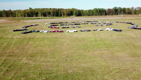 An-vista-aérea-over-a-circle-of-crushed-cars-in-a-large-field-near-Portland-Maine