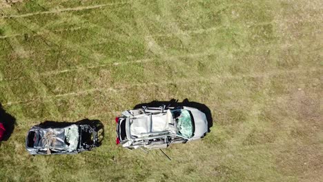 An-aerial-over-a-circle-of-crushed-cars-in-a-large-field-near-Portland-Maine-1