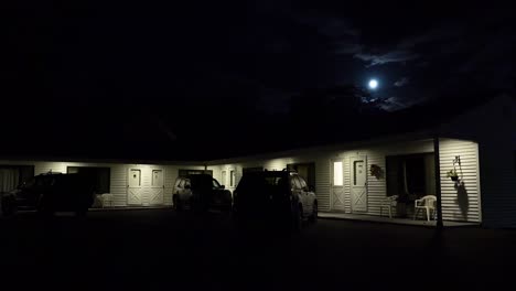 Establishing-shot-of-a-roadside-motel-under-a-full-moon-at-night-1