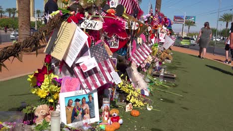 2017---thousands-of-candles-and-signs-form-a-makeshift-memorial-at-the-base-of-the-Welcome-to-Las-Vegas-sign-following-Americas-worst-mass-shooting-10