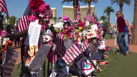 2017---thousands-of-candles-and-signs-form-a-makeshift-memorial-at-the-base-of-the-Welcome-to-Las-Vegas-sign-following-Americas-worst-mass-shooting-16