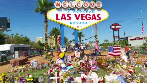 2017---thousands-of-candles-and-signs-form-a-makeshift-memorial-at-the-base-of-the-Welcome-to-Las-Vegas-sign-following-Americas-worst-mass-shooting-20