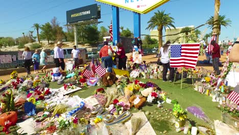 2017---thousands-of-candles-and-signs-form-a-makeshift-memorial-at-the-base-of-the-Welcome-to-Las-Vegas-sign-following-Americas-worst-mass-shooting-21