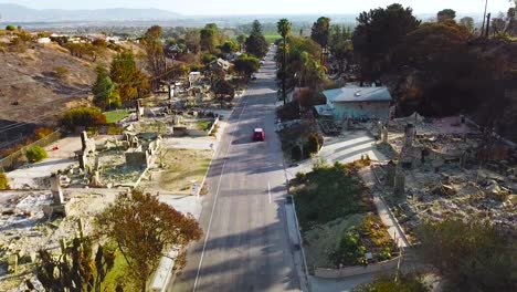 Aerial-over-entire-street-of-hillside-homes-destroyed-by-fire-in-Ventura-California-following-the-Thomas-wildfire-in-2017-9