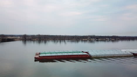 Aerial-of-a-coal-barge-moving-up-the-Mississippi-River-near-Burlington-Iowa