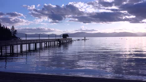 A-beautiful-sunset-behind-a-resort-and-silhouetted-pier-at-Glenbrook-Lake-Tahoe-Nevada-1