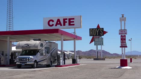 Establishing-shot-of-a-lonely-desert-gas-station-and-hotel-motel-cafe-in-the-Mojave-Desert