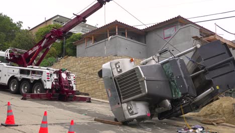 A-dump-truck-rolls-over-during-an-accident-on-a-construction-site-3