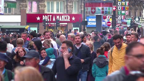 Large-crowds-of-people-move-through-Leicester-Square-London-England-at-rush-hour-1