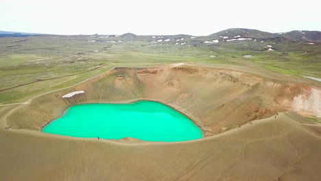 Beautiful-drone-shot-of-the-Krafla-geothermal-area-in-Iceland-with-green-lakes-and-steaming-hot-pots-2