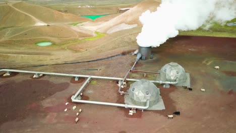 Beautiful-drone-shot-of-the-Krafla-geothermal-area-in-Iceland-with-pipes-steaming-vents-and-sheep-warming-themselves-1
