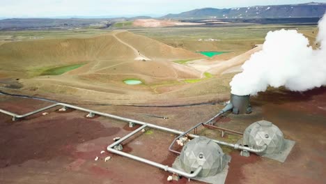 Beautiful-drone-shot-of-the-Krafla-geothermal-area-in-Iceland-with-pipes-steaming-vents-and-sheep-warming-themselves-2