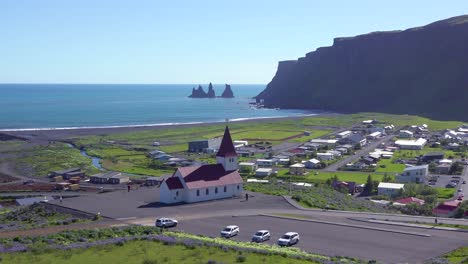 Establishing-shot-of-the-town-of-Vik-in-Southern-Iceland-its-iconic-church-1