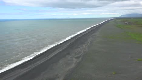 Establishing-shot-of-Dyrh_____‚laey-black-sand-beach-Iceland