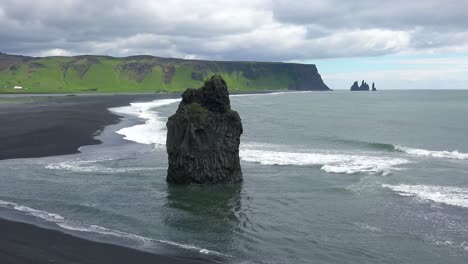 Beautiful-rock-formation-at-Dyrh_____‚laey-black-sand-beach-Iceland