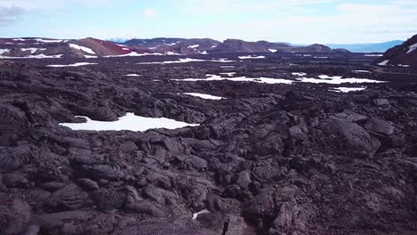 Aerial-over-vast-lava-fields-and-snow-near-Askja-Iceland-1