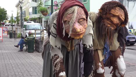 Two-giant-troll-figures-stand-on-the-streets-of-Akureyri-Iceland-1