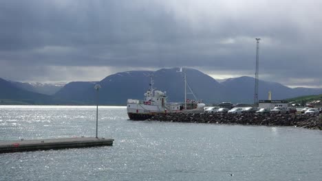 A-fishing-boat-is-docked-in-a-harbor-in-Iceland