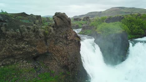 Aerial-over-the-Hjalparfoss-waterfall-in-Iceland