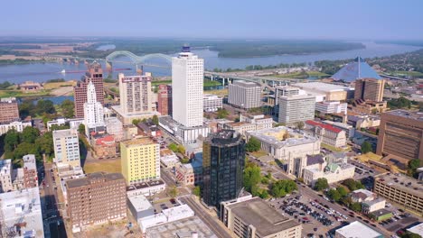 Good-aerial-of-downtown-Memphis-Tennessee-high-rises-skyscrapers-businesses-skyline-barge-on-Mississippi-River