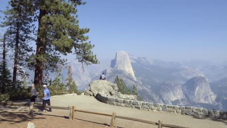 People-view-Half-Dome-and-the-High-Sierra-Mountain-Range-from-Washburn-Point-Yosemite-National-Park-California-2