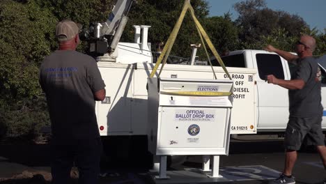 Secure-Ballot-Drop-Boxes-Drop-Off-Box-Is-Moved-Into-Position-By-Workers-In-Santa-Barbara-California-Prior-To-Us-Presidential-Elections-2