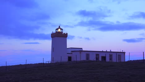 A-lighthouse-beams-a-light-out-from-the-northernmost-point-in-Scotland