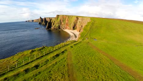 Aerial-shot-of-the-beautiful-Duncansby-Head-sea-stacks-in-Northern-Scotland