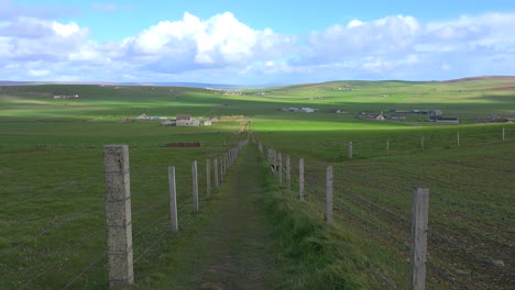 Wide-shot-of-the-green-fields-of-the-Orkney-Islands-of-Scotland-1