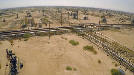 Amazing-aerial-shot-over-vast-oil-fields-and-derricks-near-Bakersfield-California-2