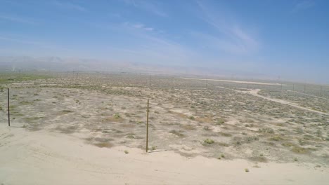 A-good-aerial-shot-over-an-oil-pumping-derrick-near-Bakersfield-California-1