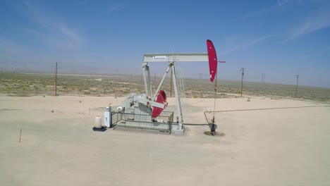 Aerial-shot-beside-an-oil-pumping-derrick