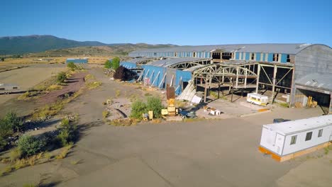 An-aerial-shot-over-an-abandoned-factory-mill-in-Northern-California