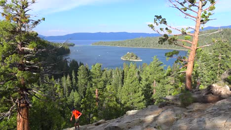 A-hiker-crosses-in-front-of-Emerald-Bay-at-Lake-Tahoe