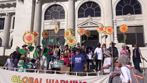 Global-warming-protestors-chant-on-a-city-street-in-front-of-a-public-building