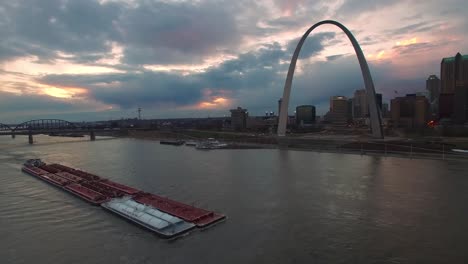Beautiful-aerial-over-a-Mississippi-river-barge-with-the-St-Louis-Missouri-skyline-background-1