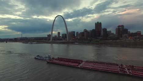 Beautiful-aerial-over-a-Mississippi-river-barge-with-the-St-Louis-Missouri-skyline-background-3