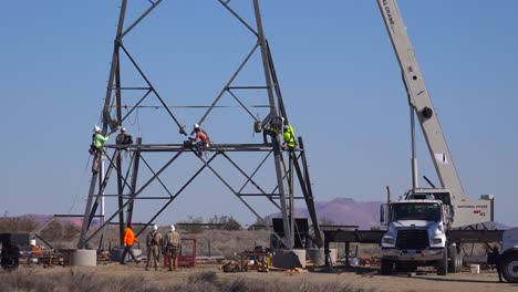 American-workers-assemble-high-tension-electrical-transformers-and-cables-to-build-US-infrastructure-1